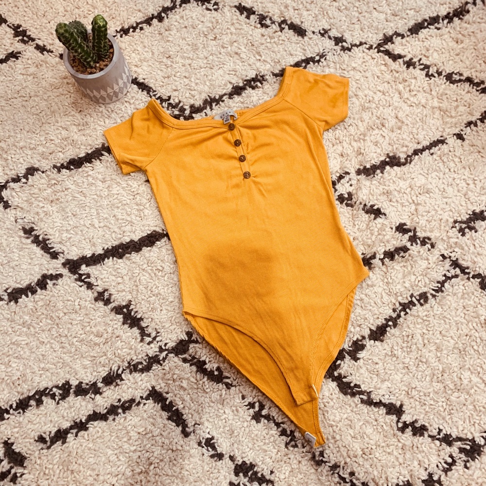 yellow bodysuit